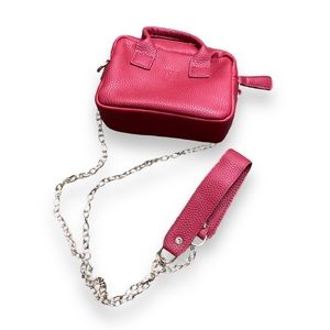 Textured red leather duffle tote bag